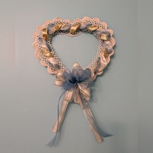Heart-Shaped Doily Wall Decor with Blue and Gold Ribbon